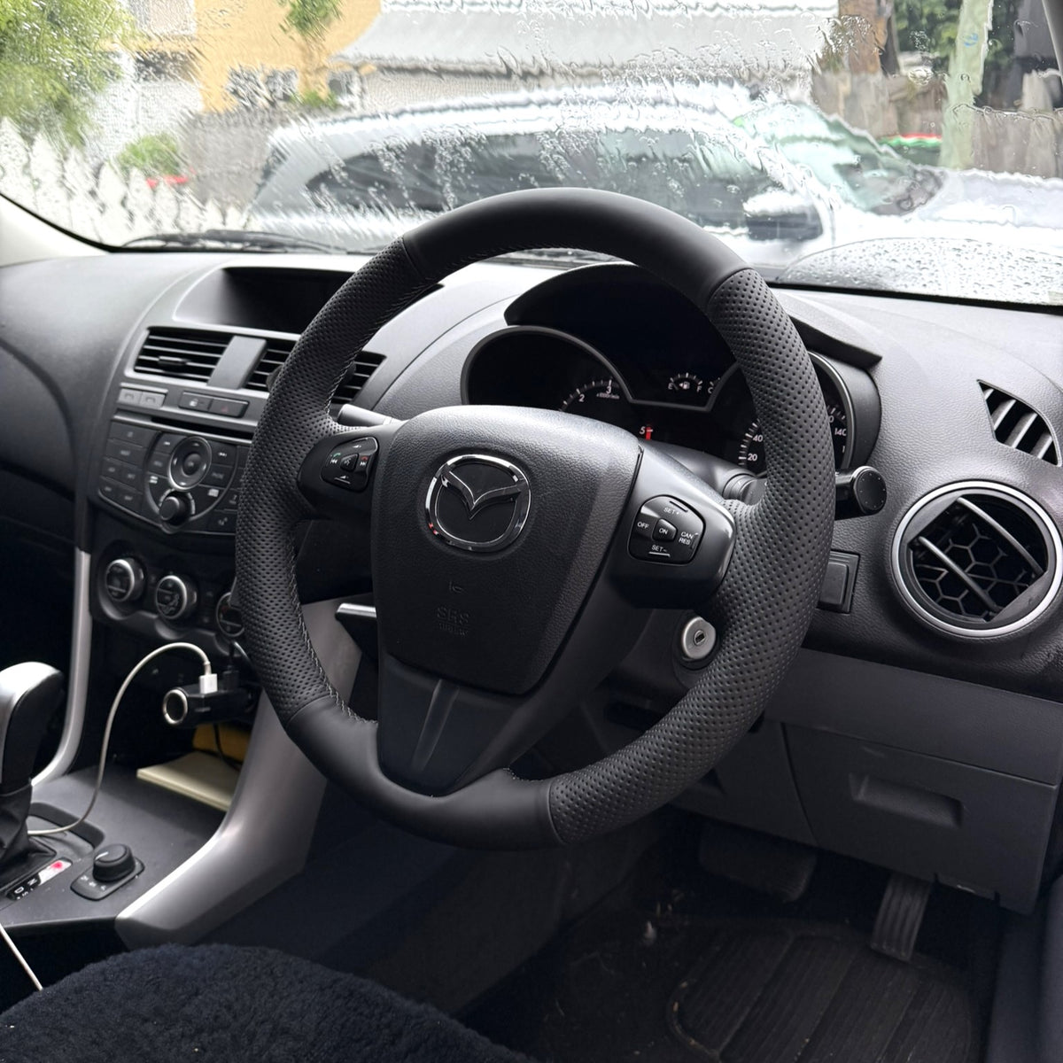 Mazda BT-50 (2011–2015) Steering Wheel Wrap – Black Leather (smooth top, perforated sides), Dark Grey stitch