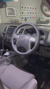 Toyota HiLux 7th Gen (2005–2015) Steering Wheel Wrap – Black Leather (smooth top, perforated sides), Black stitch