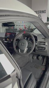 Toyota Supra A90 (2019+) Steering Wheel Wrap – Black Alcantara, Red stitch, Red Alcantara marker