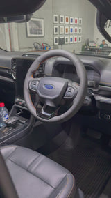 Ford Ranger / Everest Next-Gen (2022+) Steering Wheel Wrap – Black Leather (smooth top, perforated sides), Orange stitch